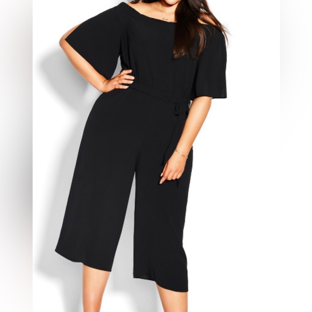 New with tags fun black jumpsuit great for the holidays .